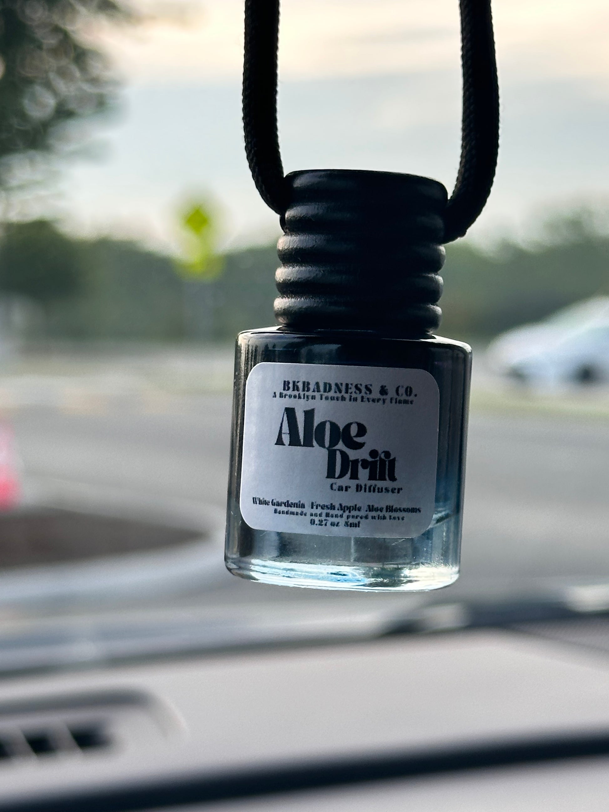 Bottle of Aloe Drift with a blurred background